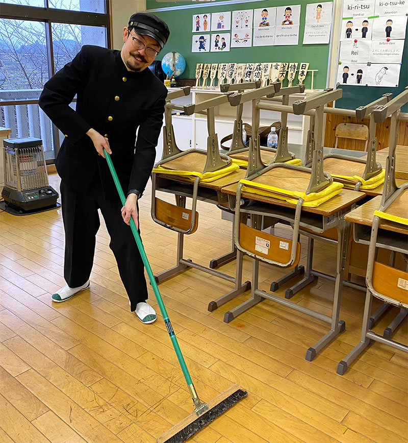 Man cleaning Japanese classroom